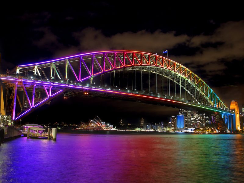 Vivid Festival light show over Sydney Harbour Bridge, viewed from Platinum Cruises